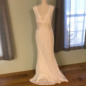 White lace-like floor length “wedding” dress